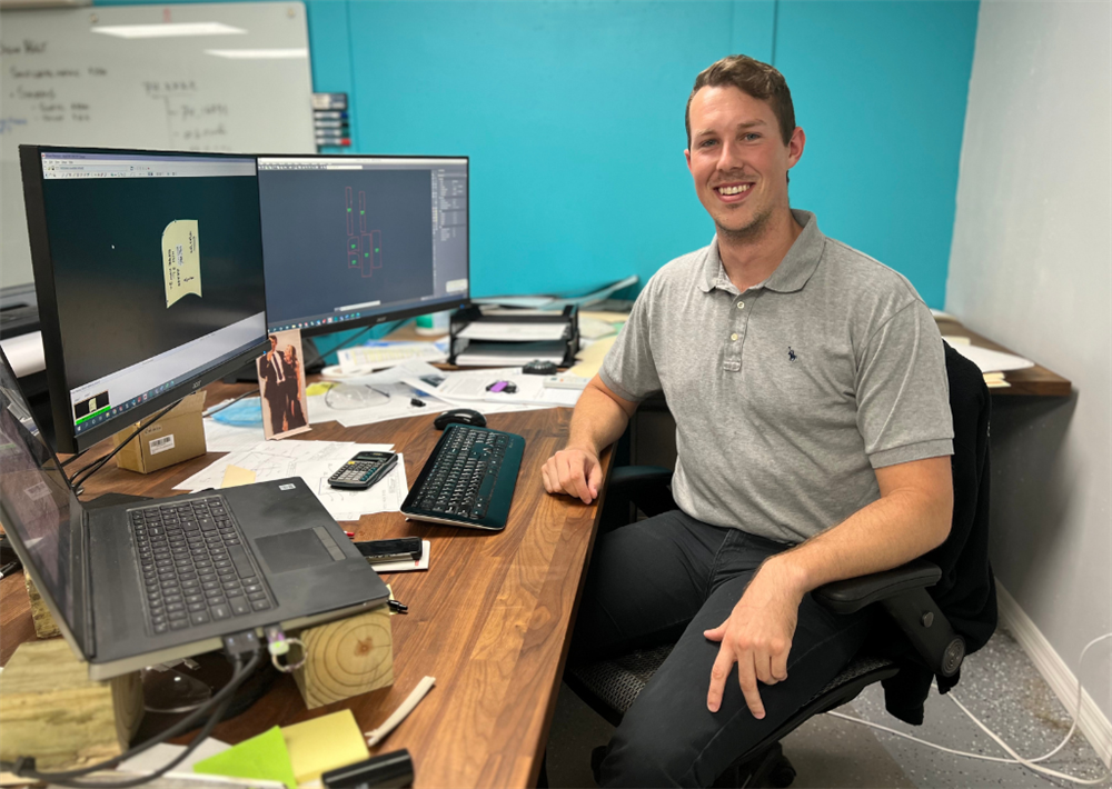 TACO Seating Engineer Matt Freeburg at his desk